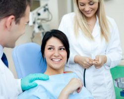 a patient being prepped for surgery by a dentist