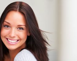 Carefree Young Woman Beaming | Smile Makeover | Alluring Smiles in Mesa, AZ - Dr. Javier Portocarrero