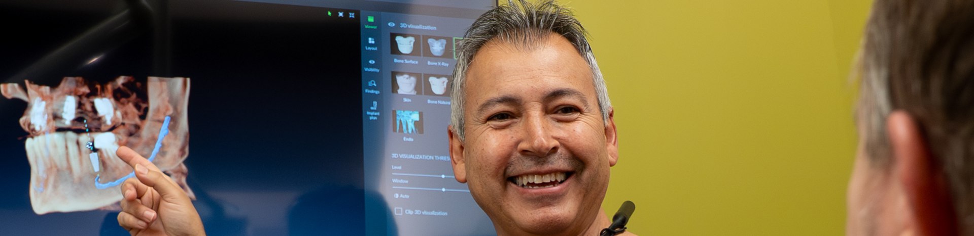 Dr. Javier Portocarrero with a patient at Alluring Smiles in Mesa, AZ