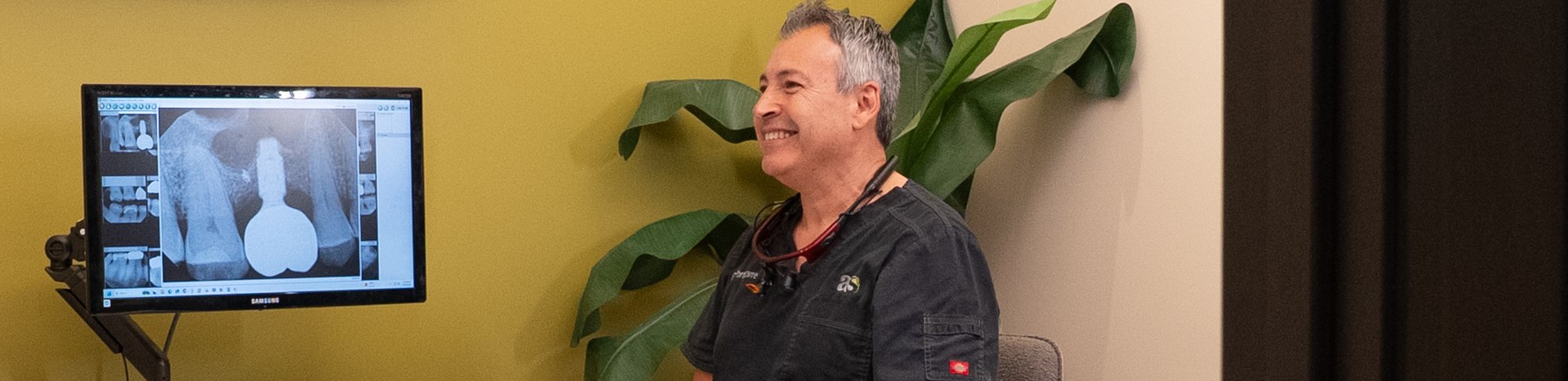 Dr. Javier Portocarrero with a patient at Alluring Smiles in Mesa, AZ
