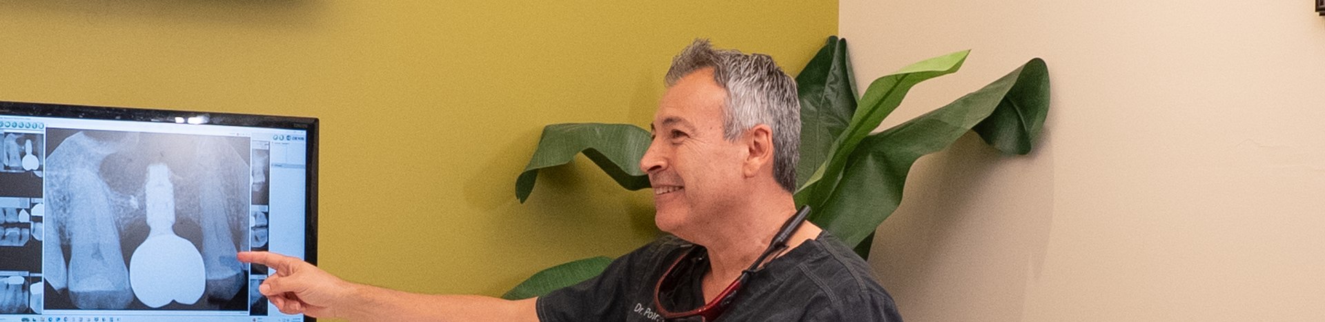 Dr. Javier Portocarrero with a patient at Alluring Smiles in Mesa, AZ